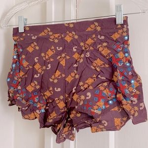 Purple and gold patterned shorts